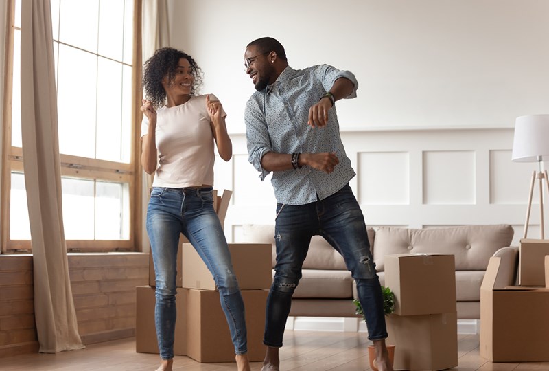 A couple moving into a new home and unpacking boxes